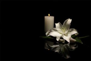 candle and lilly flowe